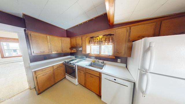 kitchen with sink and white appliances