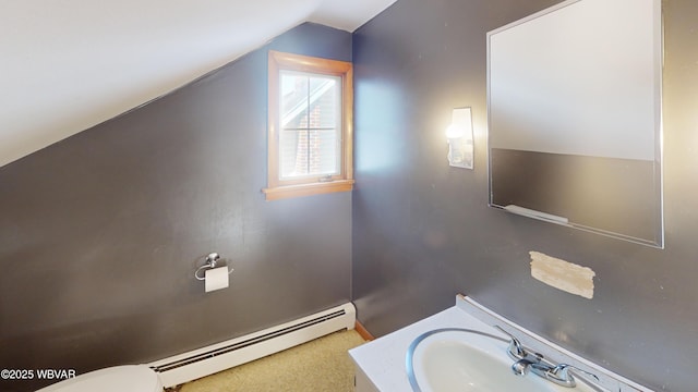 bathroom with lofted ceiling, vanity, a baseboard radiator, and toilet