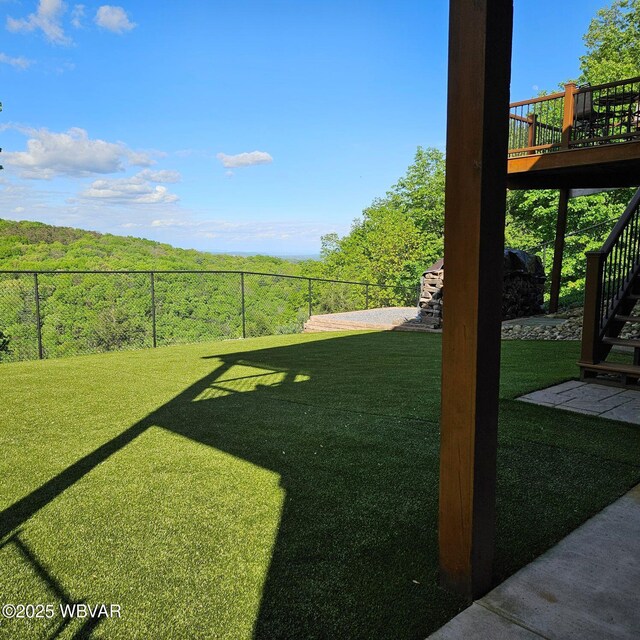 view of yard with stairway and a wooden deck