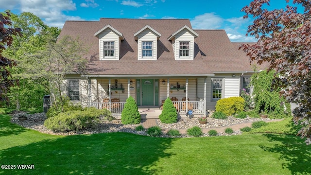 cape cod home with a front lawn, a porch, and a shingled roof