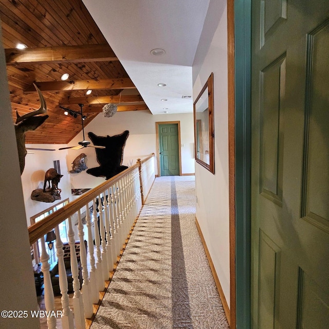 corridor with wooden ceiling, light colored carpet, baseboards, and recessed lighting