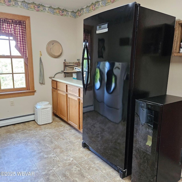 laundry area featuring a baseboard radiator