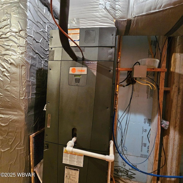 utility room with heating unit