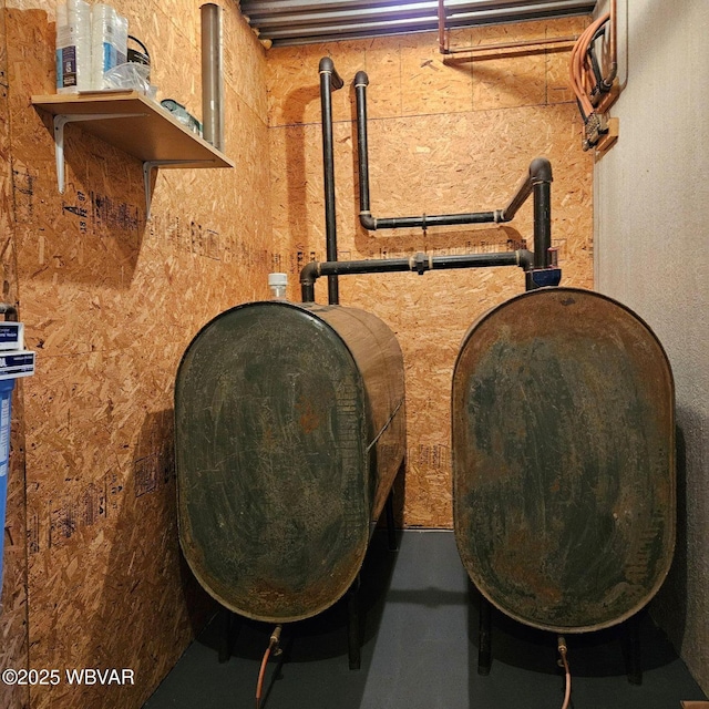 basement view of oil tank and concrete flooring