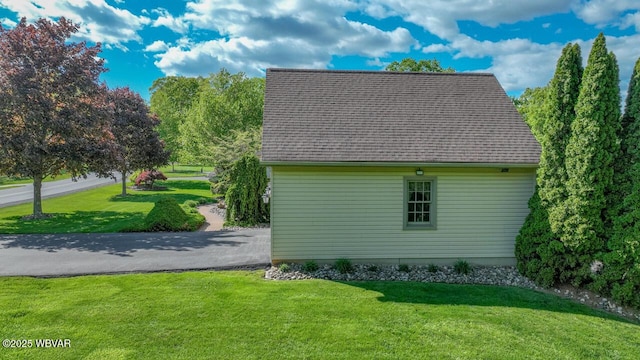 view of property exterior featuring a yard