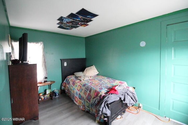 bedroom with light hardwood / wood-style floors