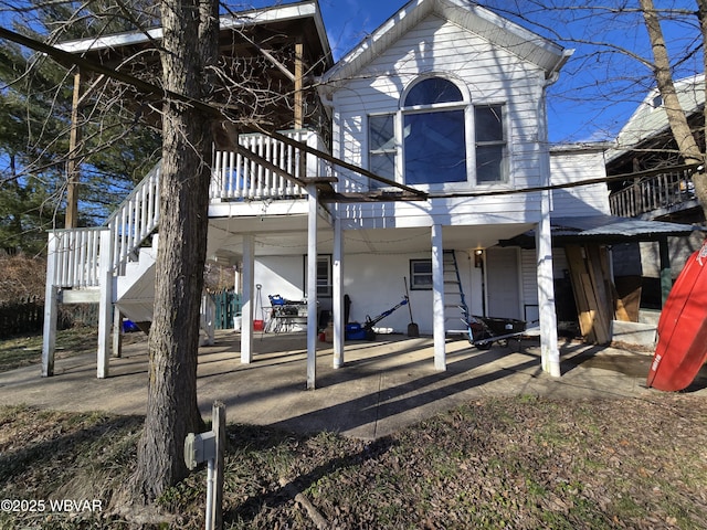 rear view of house with a patio and a deck