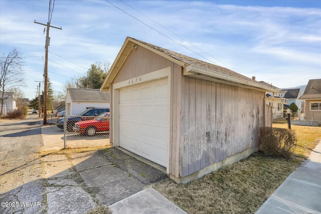 detached garage with fence