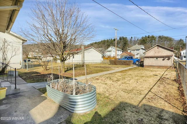 view of yard with a residential view and fence