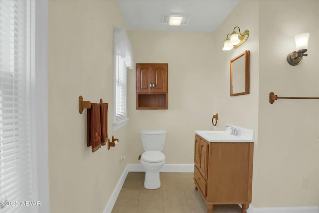 full bathroom featuring tile patterned floors, toilet, vanity, and baseboards