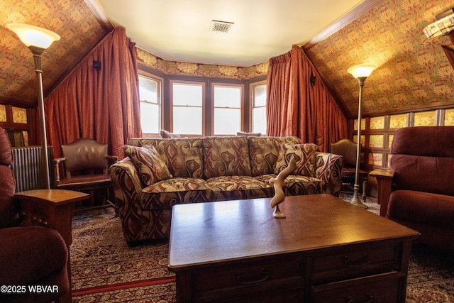 living room featuring lofted ceiling