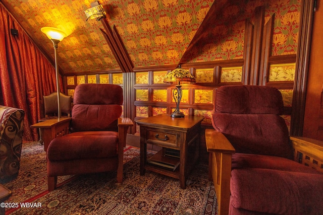 sitting room featuring lofted ceiling