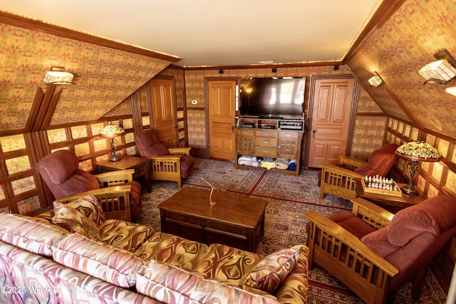 living room featuring crown molding and vaulted ceiling