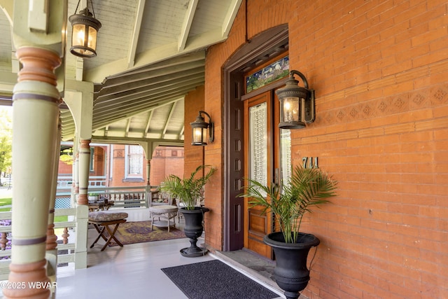 entrance to property featuring a porch