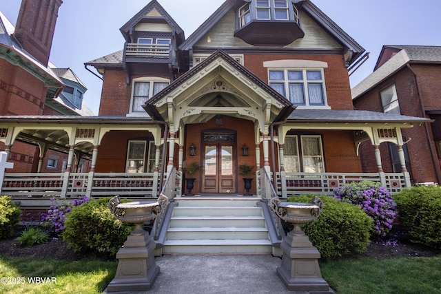 victorian-style house featuring a porch