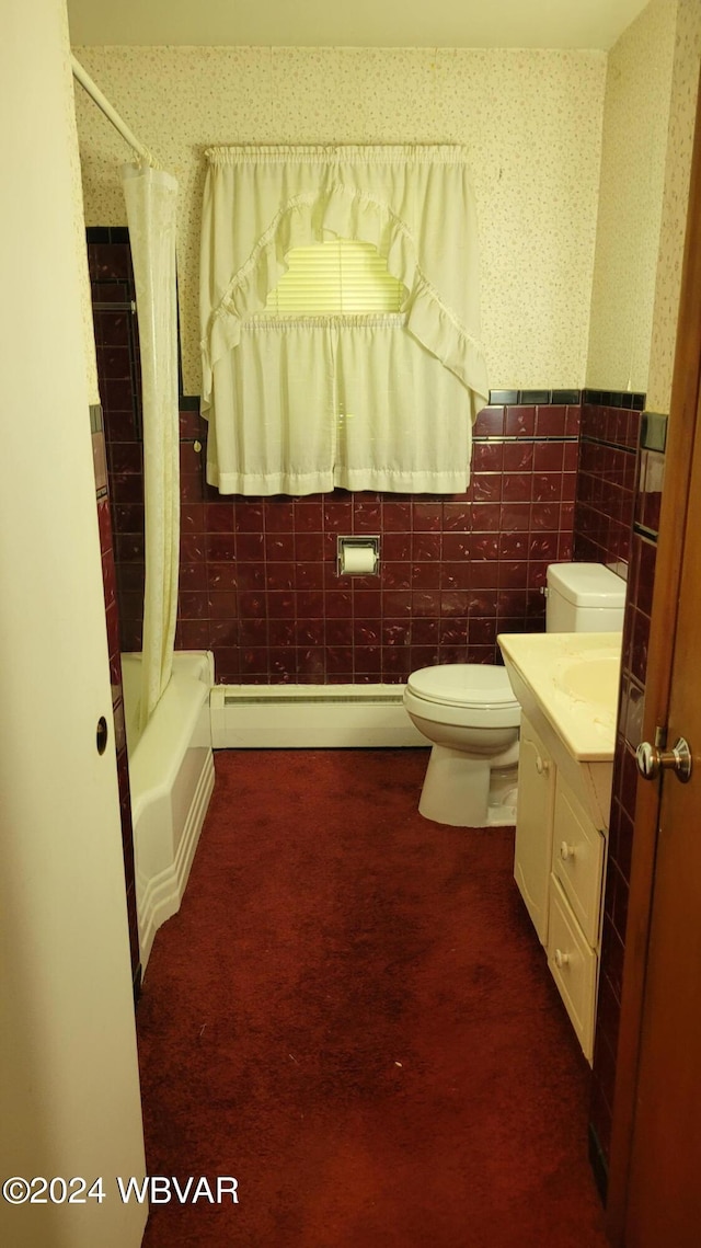 full bathroom featuring a baseboard radiator, toilet, shower / bath combo with shower curtain, vanity, and tile walls