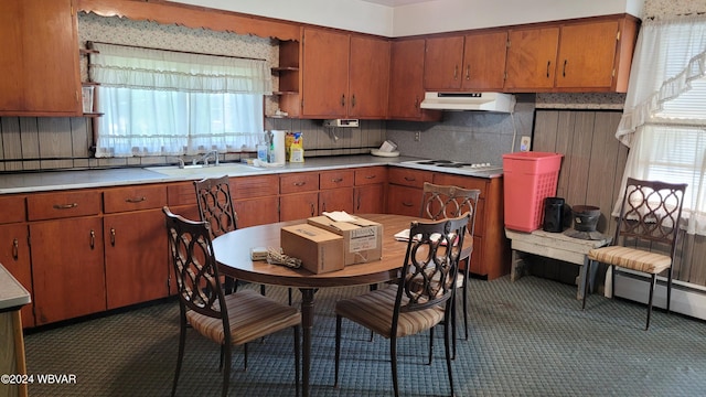 kitchen with plenty of natural light, white gas stovetop, sink, and tasteful backsplash