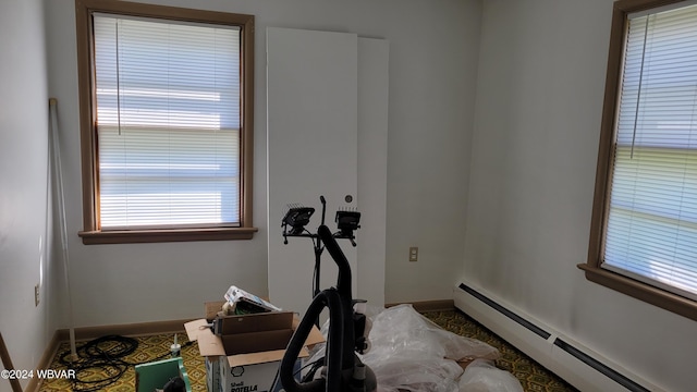 exercise room featuring a baseboard radiator