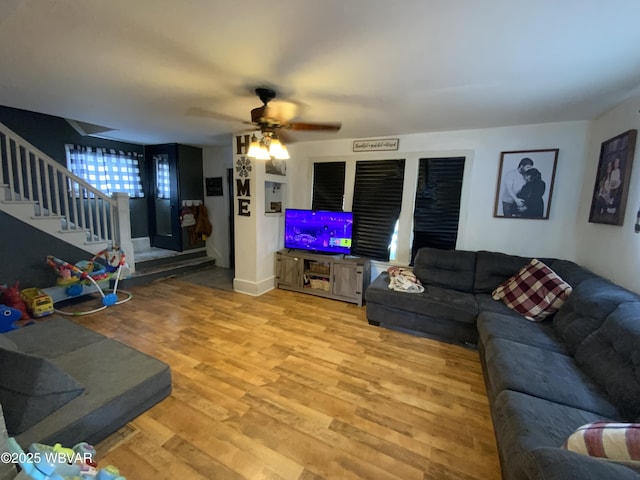 704 Prospect Ave, Lock Haven, PA 17745 - living room with light wood finished floors, stairs, and ceiling fan