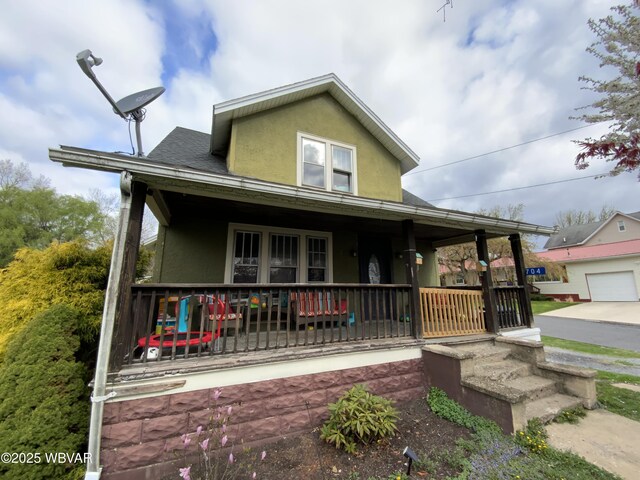 704 Prospect Ave, Lock Haven, PA 17745 - farmhouse inspired home featuring a porch and stucco siding