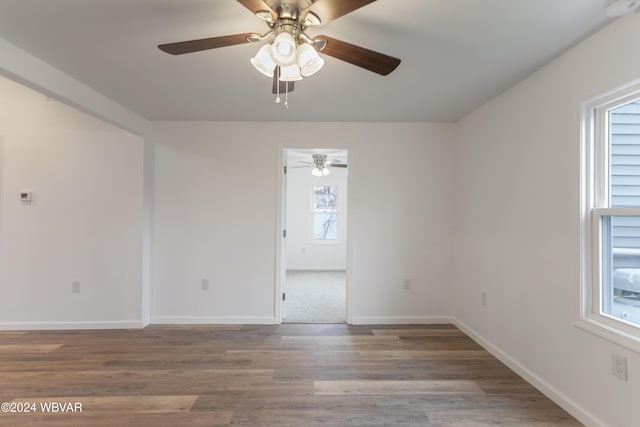 spare room with hardwood / wood-style floors