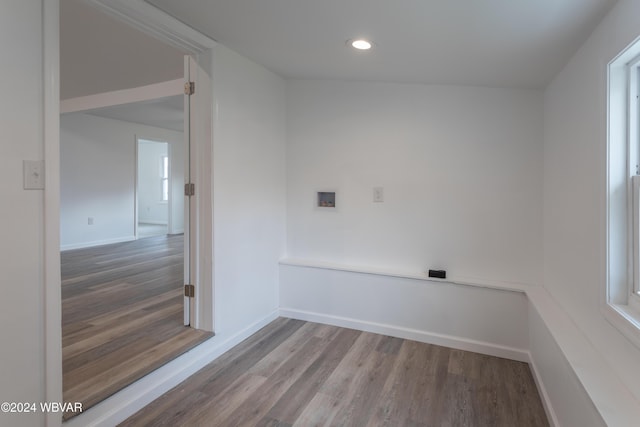 laundry area with hardwood / wood-style flooring