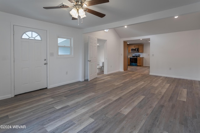 entrance foyer with vaulted ceiling with beams, hardwood / wood-style flooring, and ceiling fan