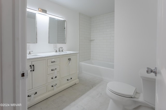 full bathroom featuring vanity, toilet, and tiled shower / bath combo