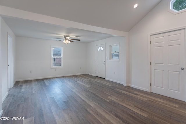 foyer with dark hardwood / wood-style floors, ceiling fan, and lofted ceiling