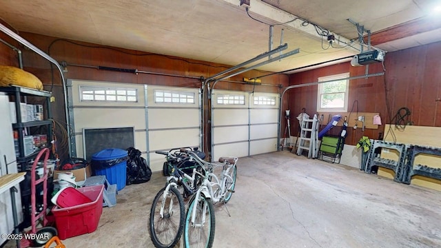 524 Pardee Rd, Millmont, PA 17845 - garage featuring a garage door opener and wooden walls