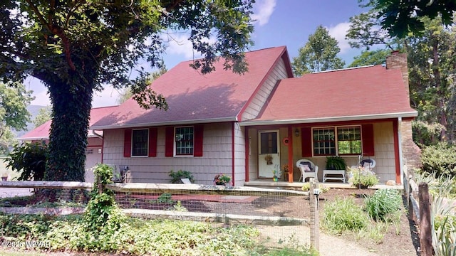 524 Pardee Rd, Millmont, PA 17845 - view of front of house with a porch, a chimney, and roof with shingles