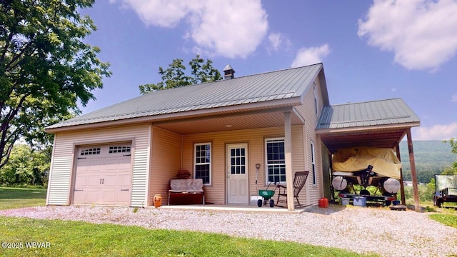 524 Pardee Rd, Millmont, PA 17845 - view of front of house featuring an attached garage, a metal roof, and driveway