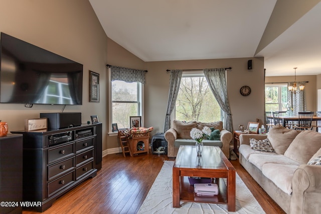 living room with lofted ceiling, hardwood / wood-style flooring, and plenty of natural light