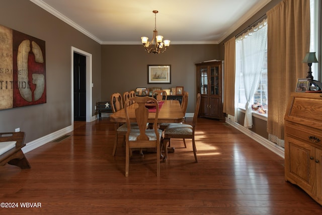 dining room with ornamental molding, a healthy amount of sunlight, dark wood-type flooring, and an inviting chandelier