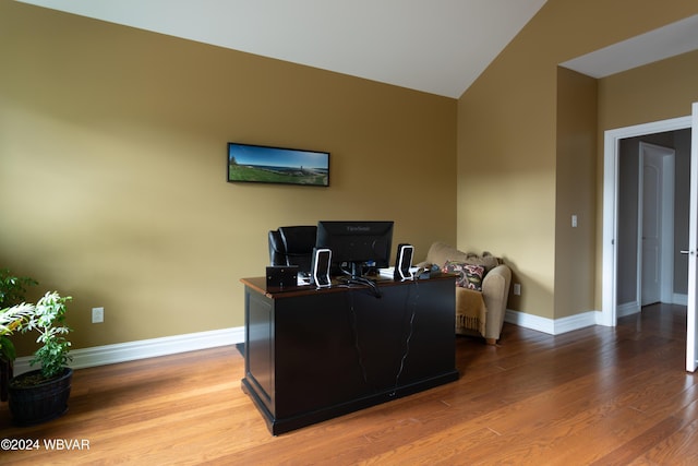 office area featuring hardwood / wood-style flooring and vaulted ceiling