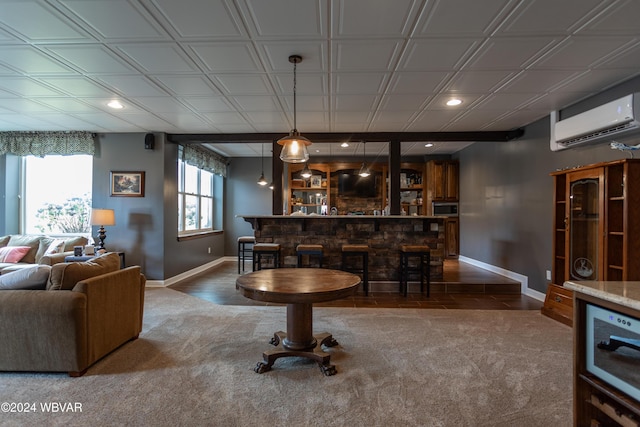 bar with a wall mounted AC, carpet floors, and hanging light fixtures