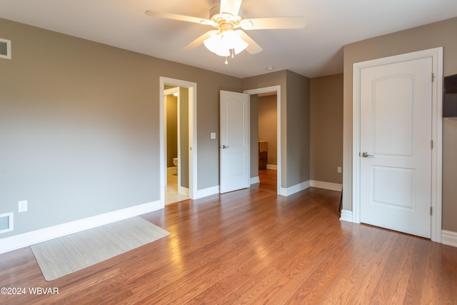 unfurnished bedroom with ceiling fan and light hardwood / wood-style floors