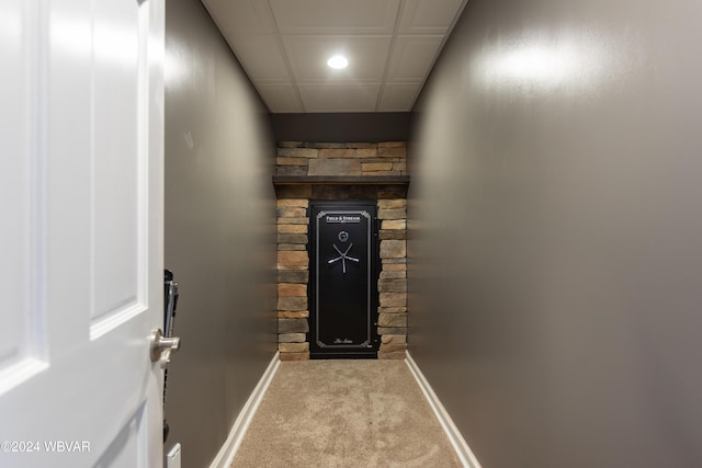 hallway with light colored carpet