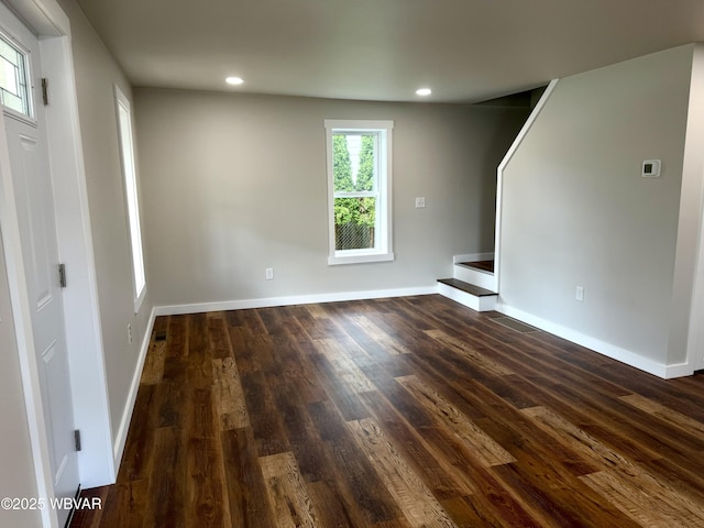 218 High St, Lock Haven, PA 17745 - unfurnished living room featuring dark wood-type flooring and recessed lighting