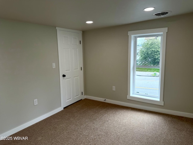 218 High St, Lock Haven, PA 17745 - empty room featuring dark carpet and recessed lighting