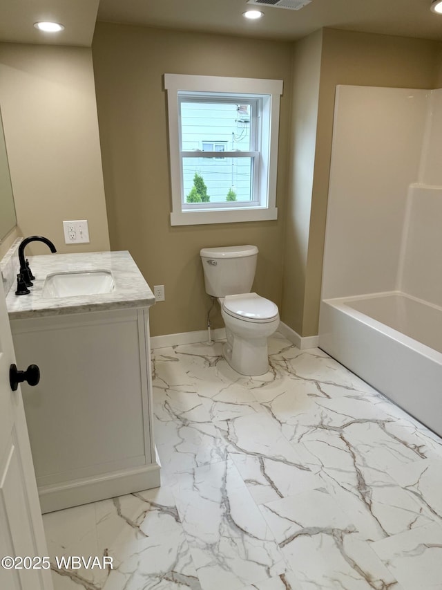 218 High St, Lock Haven, PA 17745 - bathroom with vanity, marble look tiles, and recessed lighting