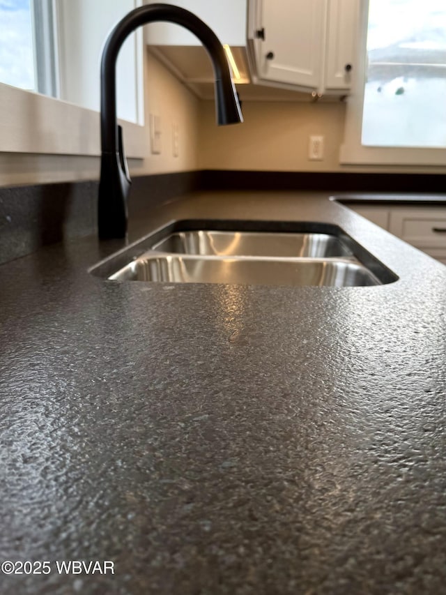 218 High St, Lock Haven, PA 17745 - kitchen view of a sink and white cabinetry