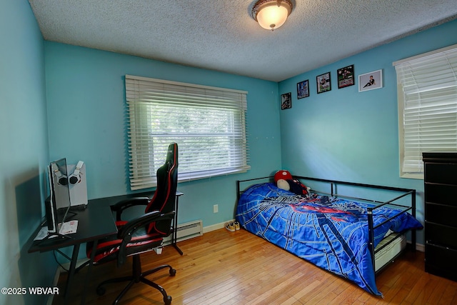 260 Selkirk Rd, Williamsport, PA 17701 - bedroom featuring hardwood / wood-style floors, a textured ceiling, an office area, and baseboards