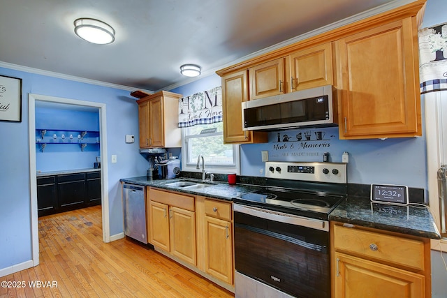 260 Selkirk Rd, Williamsport, PA 17701 - kitchen featuring appliances with stainless steel finishes, a sink, light wood-type flooring, crown molding, and baseboards