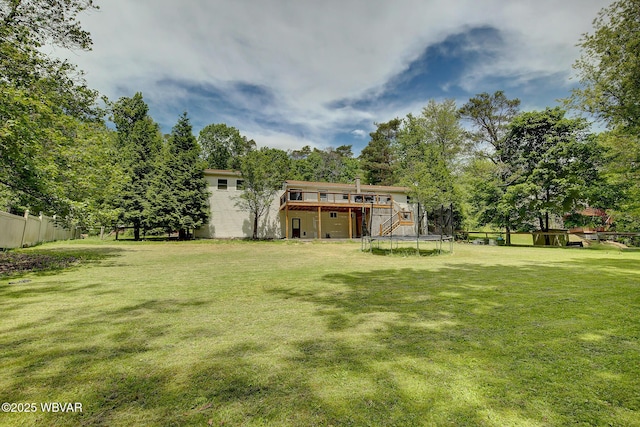 260 Selkirk Rd, Williamsport, PA 17701 - view of yard with a trampoline, a wooden deck, and view of wooded area