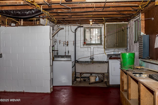 basement featuring washer / clothes dryer and a sink