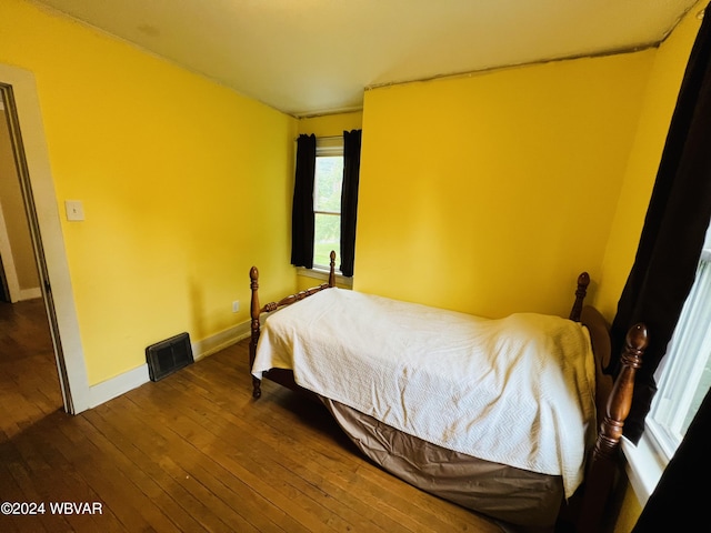 bedroom featuring dark wood-type flooring