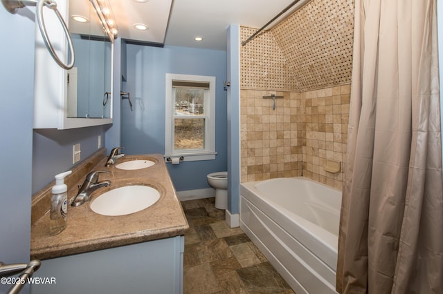 bathroom with double vanity, a sink, toilet, and shower / bathtub combination with curtain