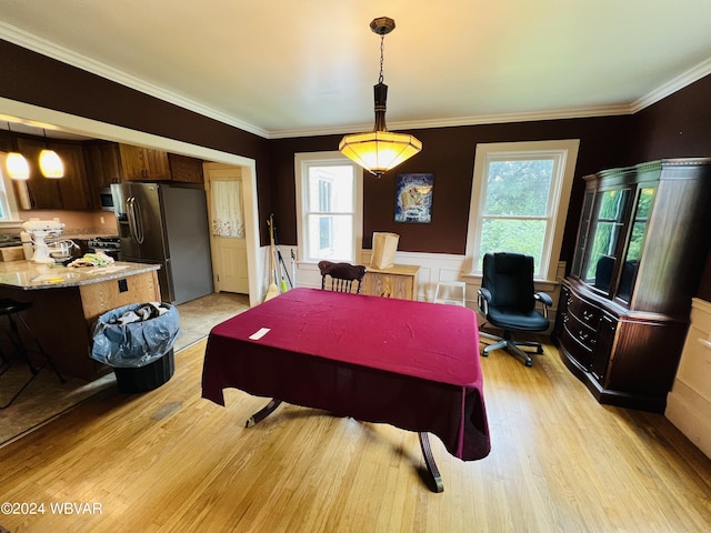 playroom with light wood-type flooring and ornamental molding