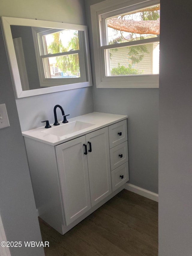 215 E 8th St, Watsontown, PA 17777 - bathroom with vanity and wood finished floors